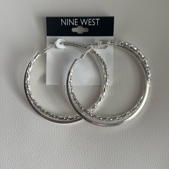 NWT Nine West Silver Tone Overlapping Hoop Earrings
OS - Picture 1 of 1
